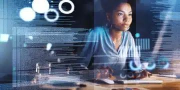 Mulher trabalhando em um computador com gráficos digitais e código em segundo plano, representando análise de dados.