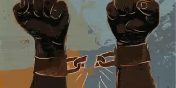 Imagem representando a luta pela abolição da escravidão no Brasil, com punhos levantados quebrando as correntes da opressão.