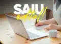 Candidato se preparando para o Concurso ESA 2027 estudando com notebook e caderno