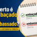 Caderno espiral mostrando "embaçado" com ç correto e "embassado" com ss incorreto, lupa ao lado