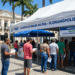 Atendimento do INSS e órgãos federais no evento Governo do Brasil na Rua na Arena Floripa com fila de cidadãos